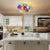 A stunning vibrant glass chandelier with translucent orbs that create beautiful light patterns.